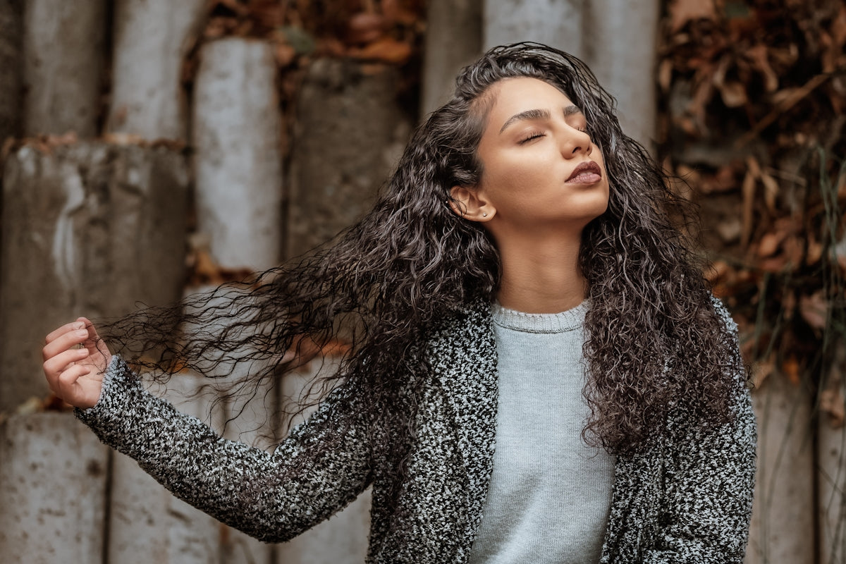 woman holding her hair