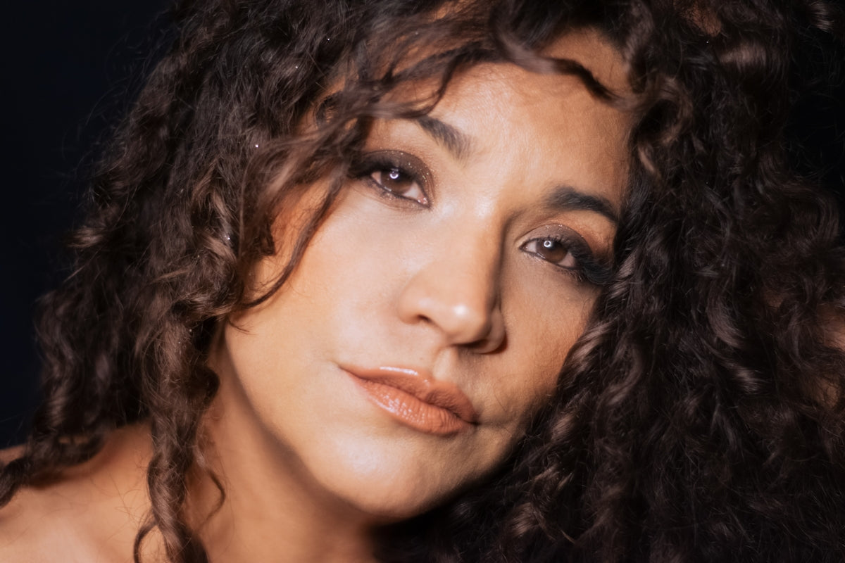 woman with black curly hair