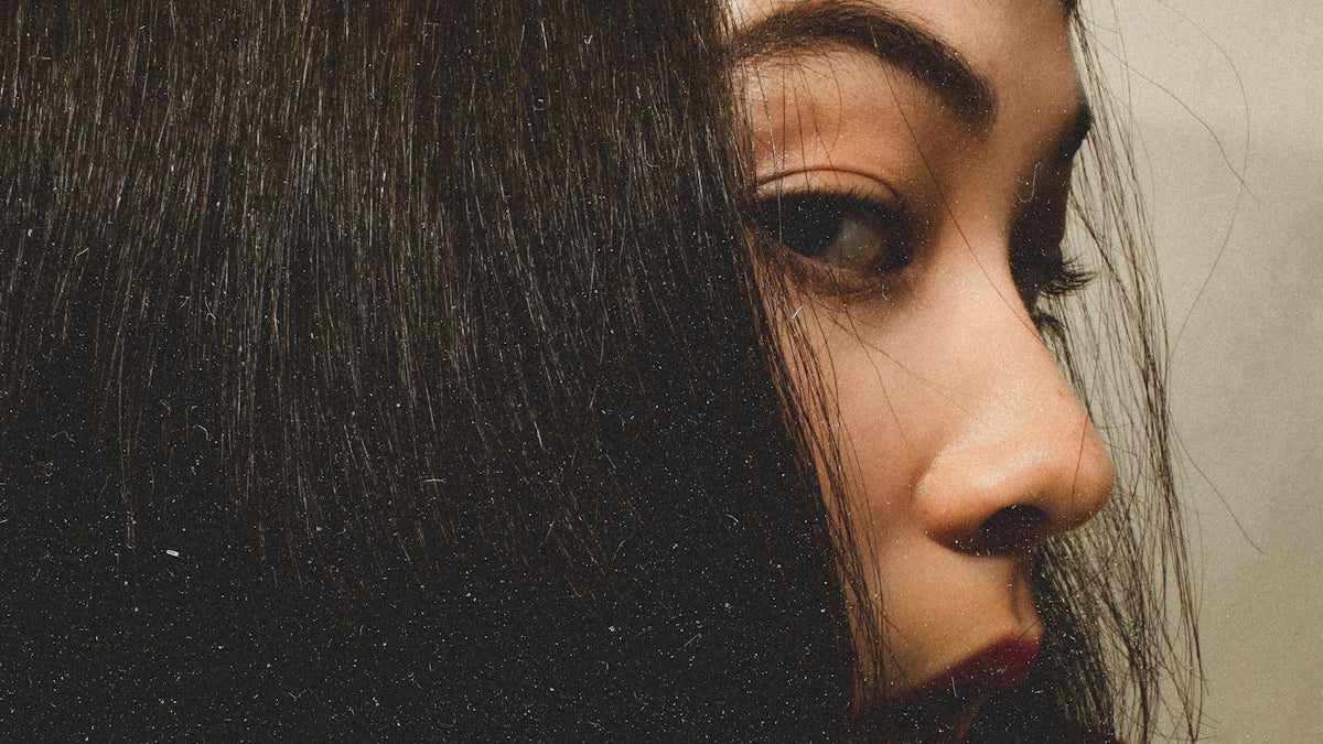 womans face with black hair